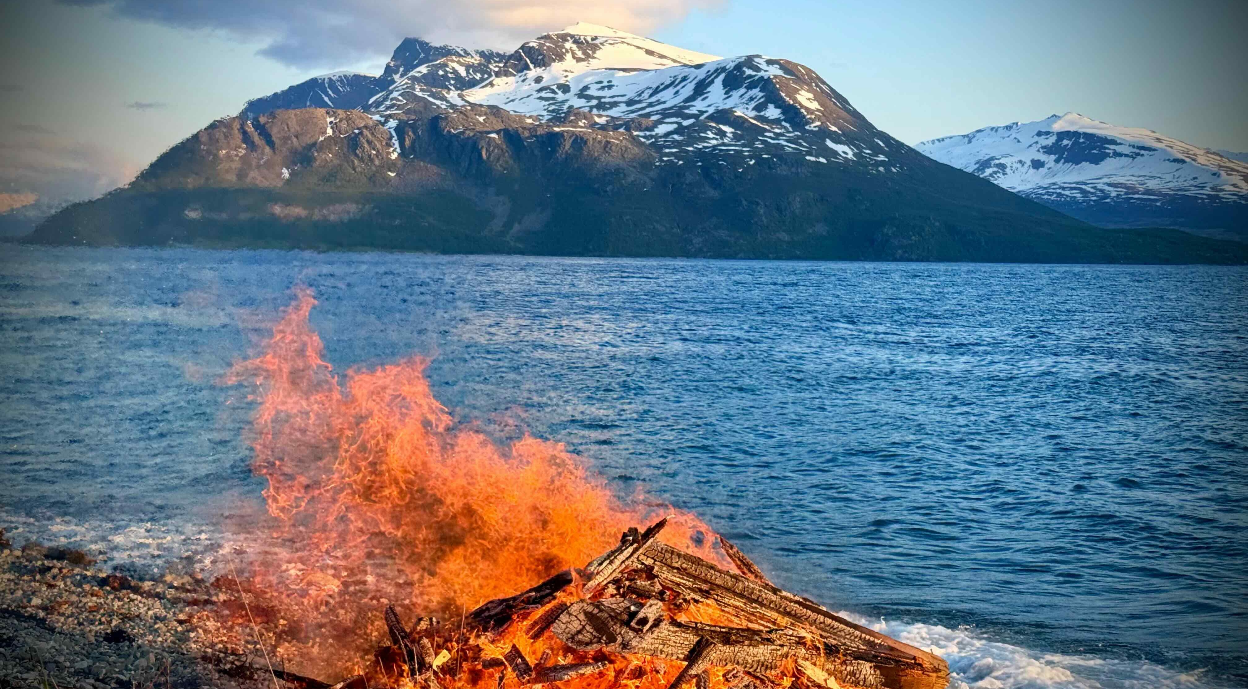 Dramatic fire by the fjord