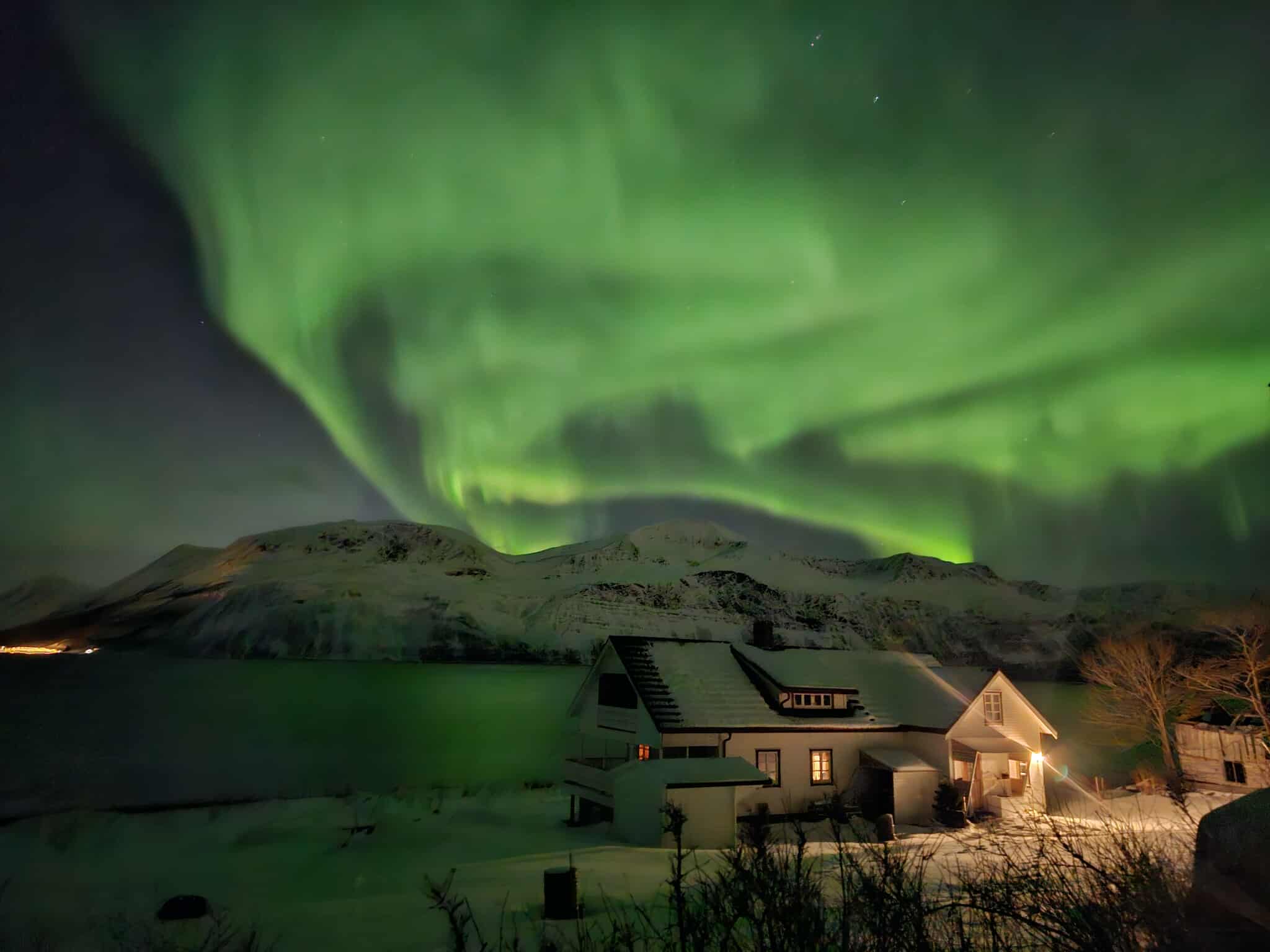 Northern lights dancing over Lyngen mountains
